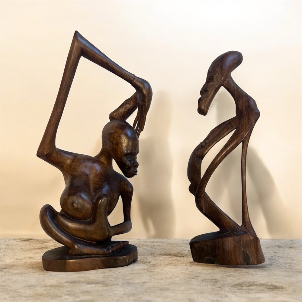 Two vintage hand carved statues